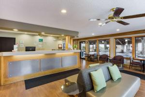 a lobby with a couch and a bar at Quality Inn in Athens