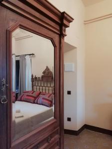 A bed or beds in a room at Hostal Rural Mas Blanc