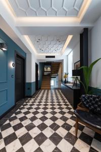 a hallway with a checkered floor in a building at Λιθεία-Lithia in Ioannina