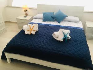 A bed or beds in a room at Casa Caterina Deluxe Sorrento Coast