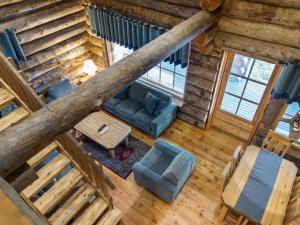 an overhead view of a living room in a log cabin at Holiday Home Luostakka small by Interhome in Ylläsjärvi +10 photos