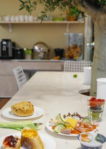 two plates of food sitting on a table at Town Hotel Wiesbaden - kleines Privathotel in Bestlage in Wiesbaden