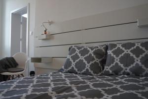 Posteľ alebo postele v izbe v ubytovaní Apartament Gliwice Centrum Witkiewicza I