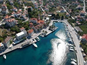 an aerial view of a harbor with boats in the water at Villa Keti apartments Pool & Wellness in Splitska