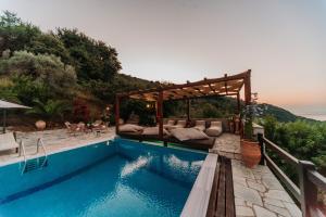 The swimming pool at or close to Elysian Luxury Villa Pelion