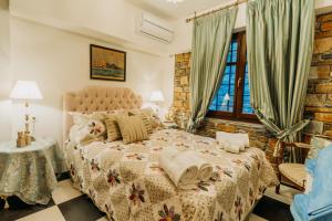 A bed or beds in a room at Elysian Luxury Villa Pelion