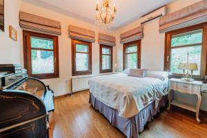 A bed or beds in a room at Elysian Luxury Villa Pelion