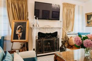 A television and/or entertainment centre at Elysian Luxury Villa Pelion