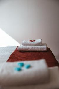 a bed with two towels on top of it at North-Hotel in Hamburg +34 photos