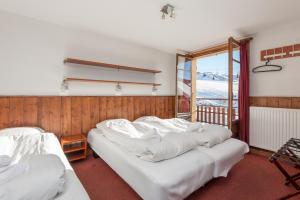 Postel nebo postele na pokoji v ubytování Hotel Le Refuge