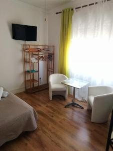 TV a/nebo společenská místnost v ubytování B&B Alghero Republic