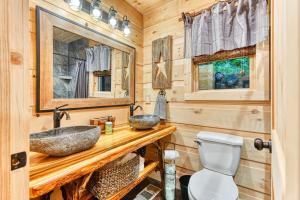 a bathroom with a sink and a toilet at The Grand Fir in Gatlinburg