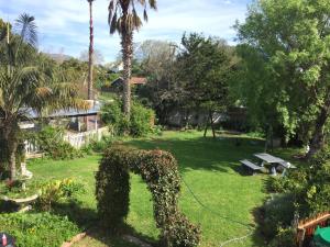 a statue of a dog in a yard at Constantia Lazy River in Cape Town