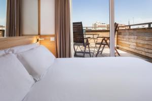 Cama o camas de una habitación en B&B HOTEL Tarragona Centro Urbis