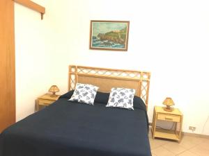 Postel nebo postele na pokoji v ubytování Clorinda - Immobilevante