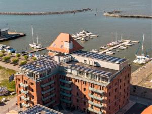 an image of a building with solar panels on its roof at Speicher Residenz Barth E4 App 9 in Barth +2 photos