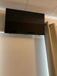 a flat screen tv hanging on a wall at LA BUSSOLA in Badia Polesine