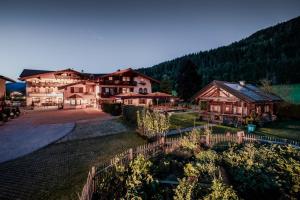 an aerial view of a village with wooden buildings at BERGZEIT by seven in Flachau