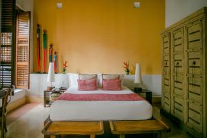 Ένα ή περισσότερα κρεβάτια σε δωμάτιο στο Hotel Quadrifolio