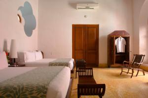 Ένα ή περισσότερα κρεβάτια σε δωμάτιο στο Hotel Quadrifolio