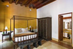 Ένα ή περισσότερα κρεβάτια σε δωμάτιο στο Hotel Quadrifolio