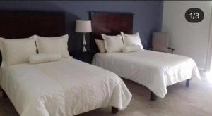 A bed or beds in a room at Grann Hotel