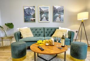 a living room with a couch and a coffee table at Portland Street Leamington Spa Apartments in Leamington Spa