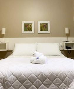 Cama ou camas em um quarto em Verona Parque Hotel