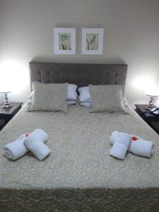 Cama ou camas em um quarto em Verona Parque Hotel