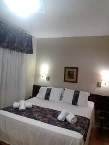 Cama ou camas em um quarto em Verona Parque Hotel
