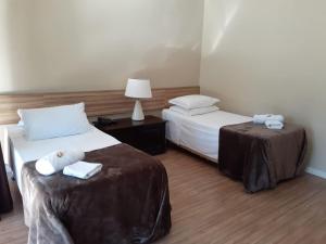 Cama ou camas em um quarto em Verona Parque Hotel