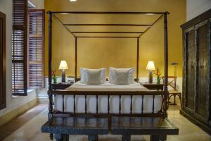 Ένα ή περισσότερα κρεβάτια σε δωμάτιο στο Hotel Quadrifolio