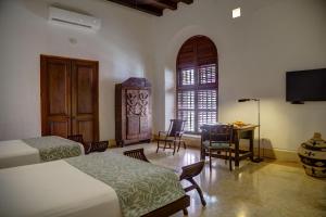 Ένα ή περισσότερα κρεβάτια σε δωμάτιο στο Hotel Quadrifolio