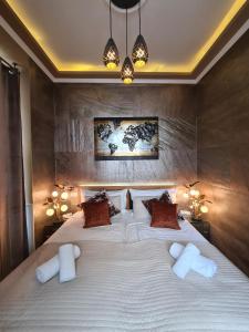 Postel nebo postele na pokoji v ubytování Urban Boutique Hotel
