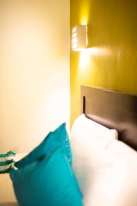 Postel nebo postele na pokoji v ubytování Asilé Hotel Boutique