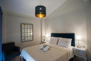 Ένα ή περισσότερα κρεβάτια σε δωμάτιο στο Nicopolis Villa