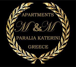 a gold laurel wreath on a black background at M & M White Luxury in Paralia Katerinis
