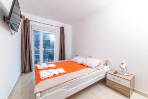 Llit o llits en una habitació de Java Apartments