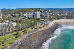 an aerial view of a beach and the ocean at Bujerum Apartments on Burleigh in Gold Coast