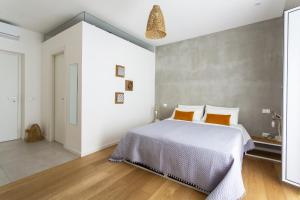 Postel nebo postele na pokoji v ubytování Canceddi Rooms