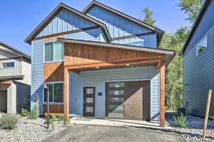 a house with a garage with a roof at Bozeman Stand-Alone Home with River Access! in Bozeman