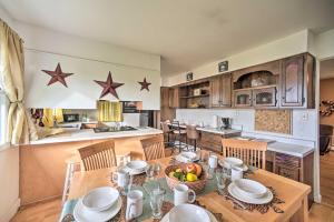 a kitchen and dining room with a table and chairs at Albany Home with Fenced Yard and Patio - Pets Welcome! in Albany