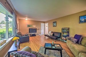 a living room with a couch and a tv at Albany Home with Fenced Yard and Patio - Pets Welcome! in Albany