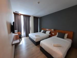 Postel nebo postele na pokoji v ubytování Hotin Inn