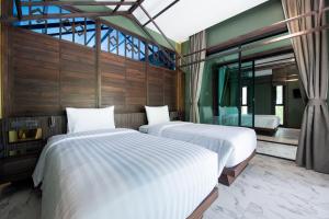 Voodi või voodid majutusasutuse Ao Cho Grandview Hideaway Resort toas