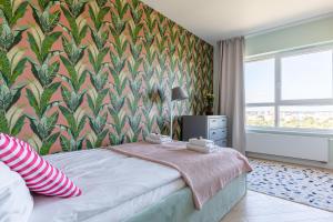 Posteľ alebo postele v izbe v ubytovaní Apartamenty Your Seaside