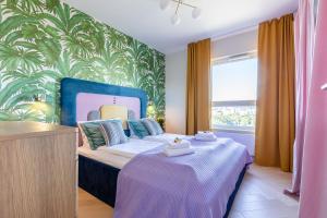 Posteľ alebo postele v izbe v ubytovaní Apartamenty Your Seaside