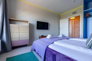Posteľ alebo postele v izbe v ubytovaní Apartamenty Your Seaside
