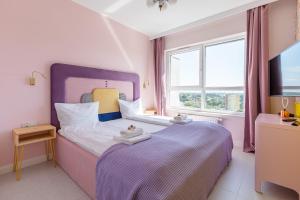 Posteľ alebo postele v izbe v ubytovaní Apartamenty Your Seaside