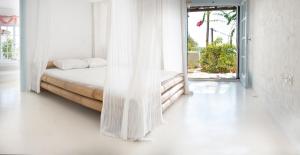 Posteľ alebo postele v izbe v ubytovaní Villa Arios, pool, jacuzzi and sea